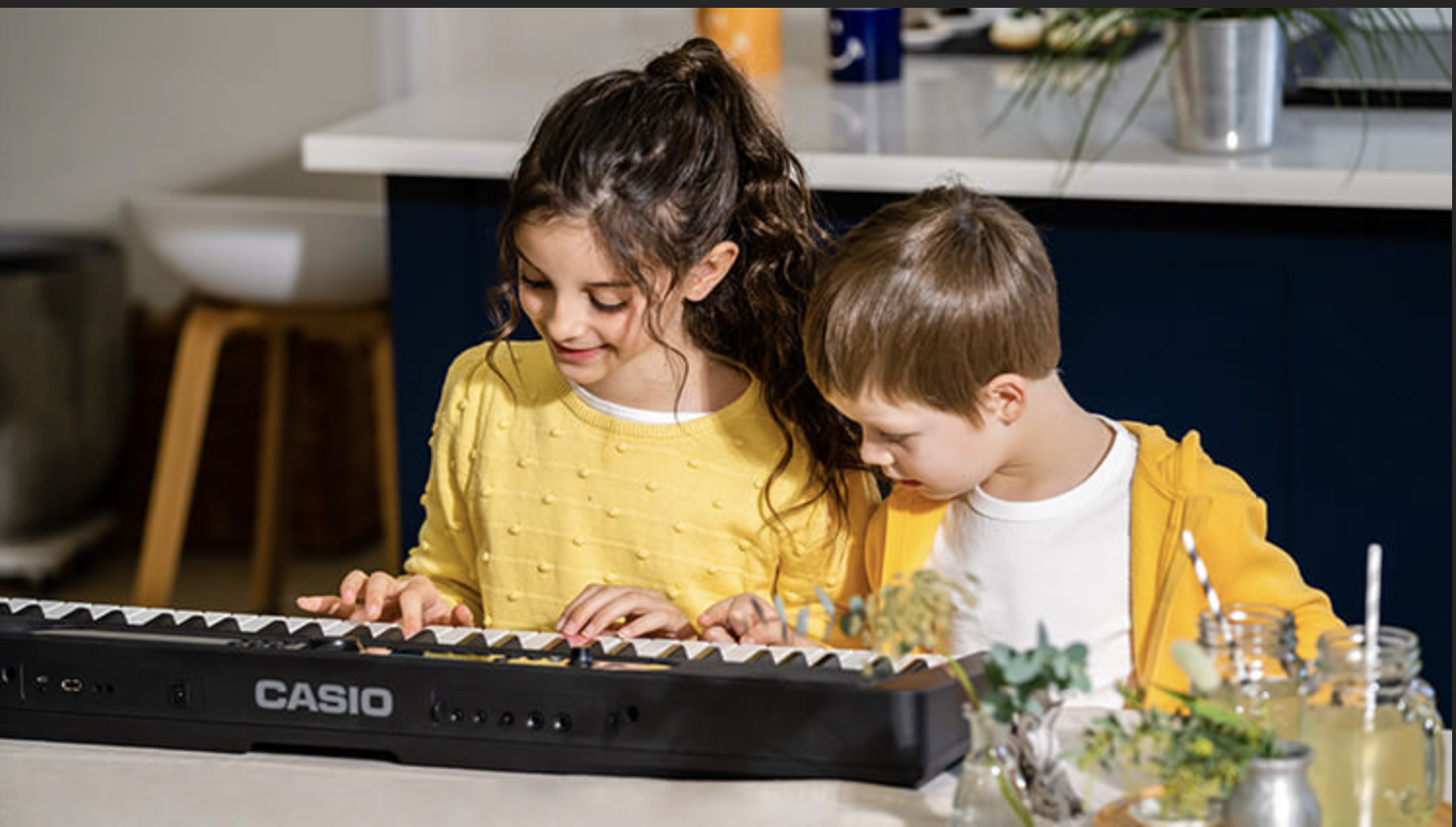 two children using Casio LK-S450 Keyboard